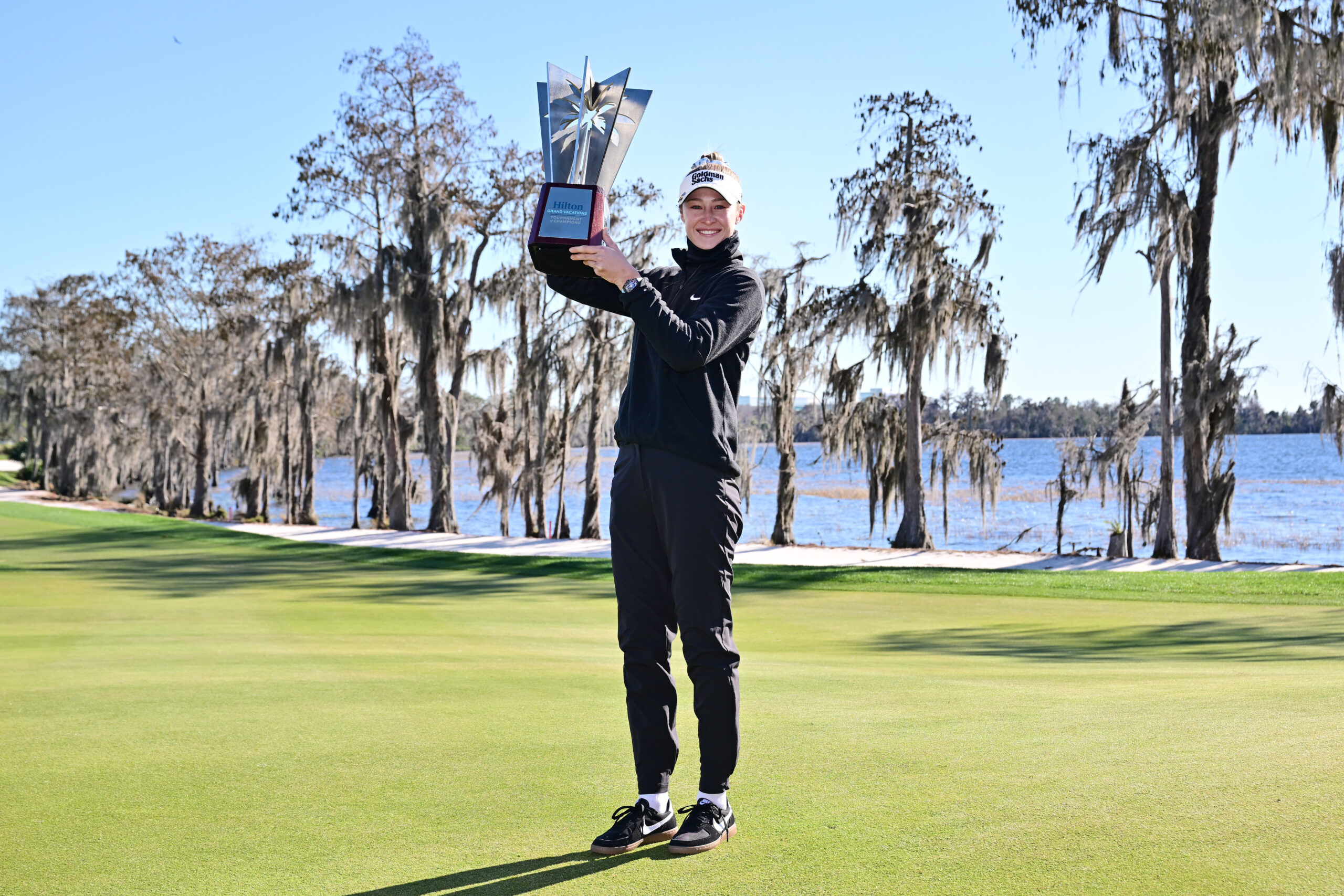 Nelly Korda poses with the trophy bundled up following the completion of the third round of the 2026 Hilton Grand Vacations Tournament of Champions