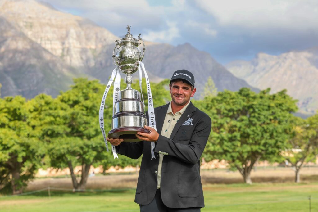 Casey Jarvis hoists the trophy after the final round of the 2026 Investec South African Open Championship at Stellenbosch Golf Club.
