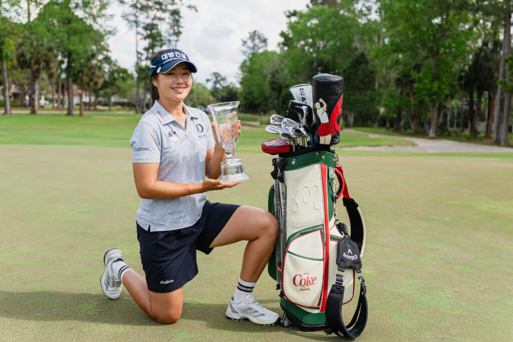 Lee6 posing with the trophy after the final round of the 2026 IOA Golf Classic.