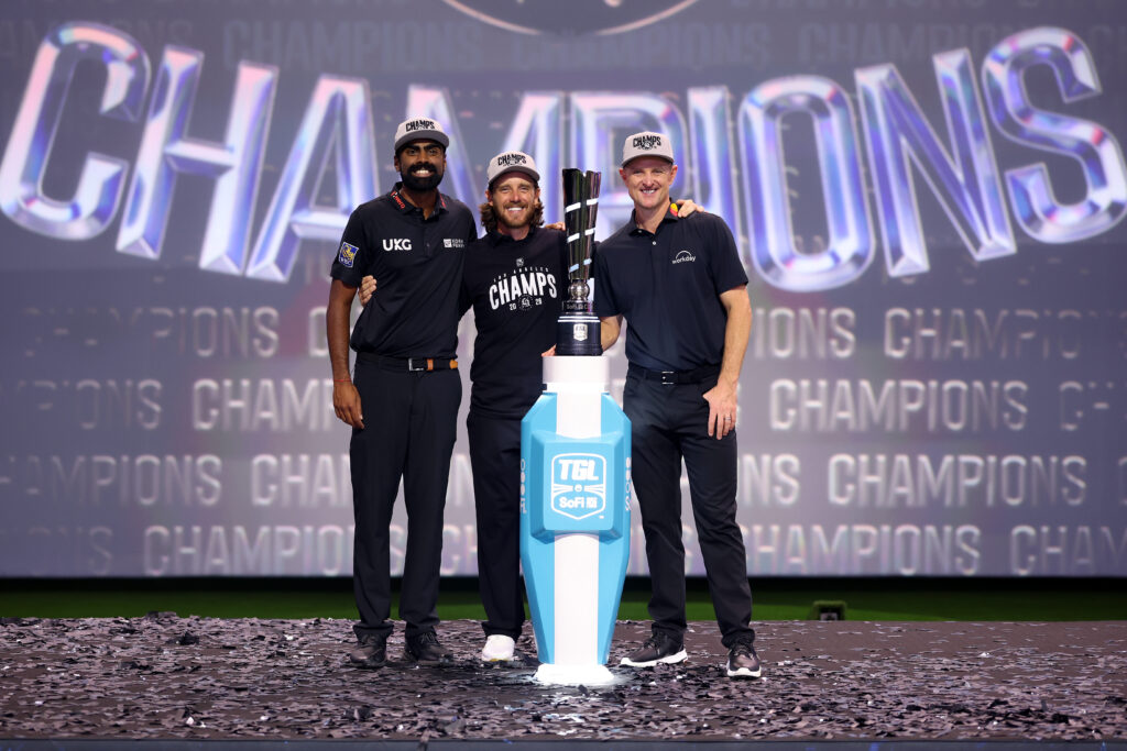 Sahith Theegala, Tommy Fleetwood and Justin Rose of the Los Angeles Golf Club pose with the trophy after defeating the Jupiter Links Golf Club at SoFi Center.