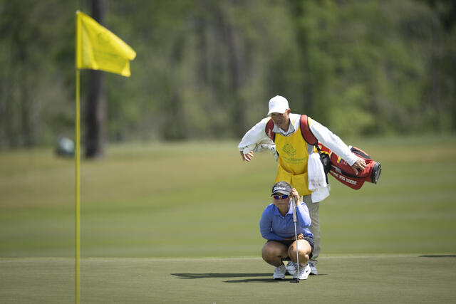 Current co-leader Maria Jose Marin of Colombia reads the ninth green with her caddie at Champions Retreat.