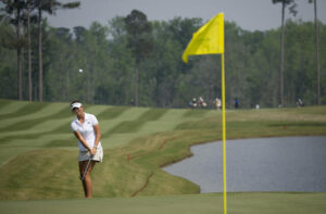 Asterisk Talley chips on hole up on hole 18 for a tap-in par.