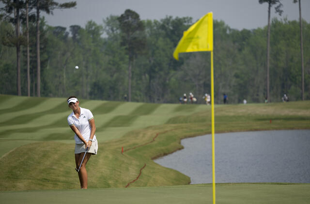 Asterisk Talley chips on hole up on hole 18 for a tap-in par.