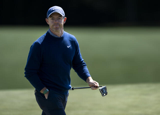 Defending champion Rory McIlroy heads to the 18th tee after the first round of the 2026 Masters.