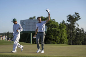 Rory McIlroy waves to the patrons walking off the 18th green after Round 2 of the 2026 Masters.