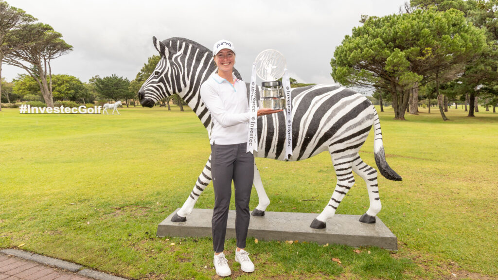 Esme Hamilton hoists her trophy. 