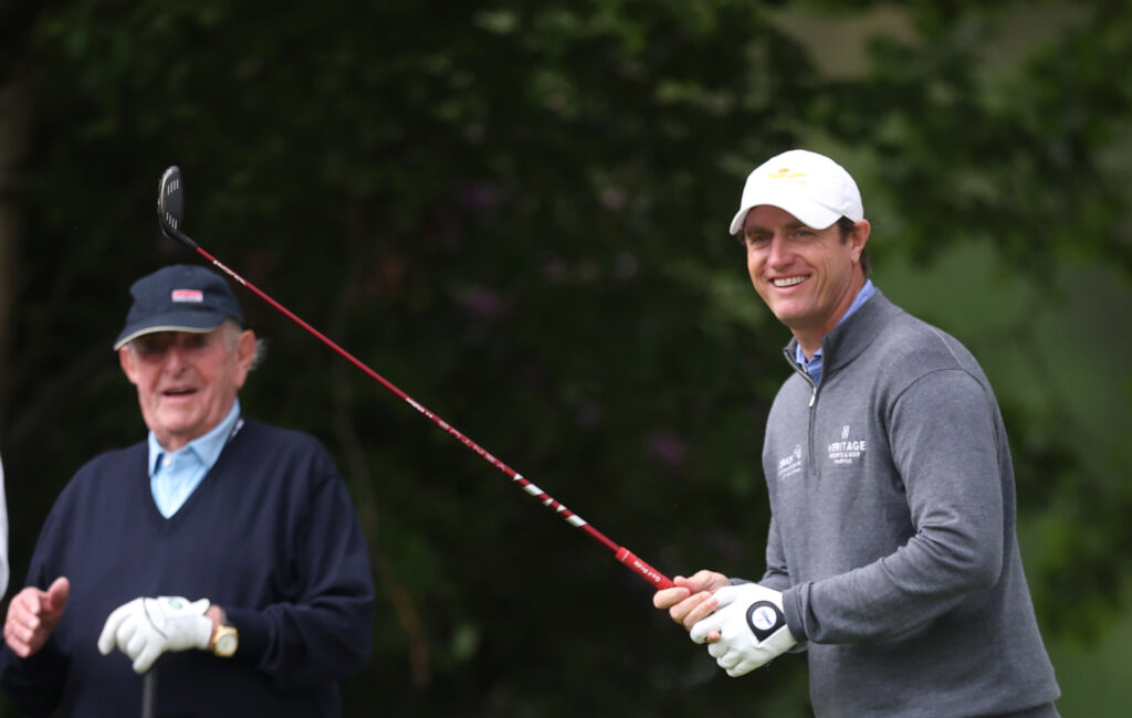 Nicolas Colsaerts of Belgium plays in the pro-am watched by Vic Swerts, CEO of Soudal, ahead of the 2026 Soudal Open.