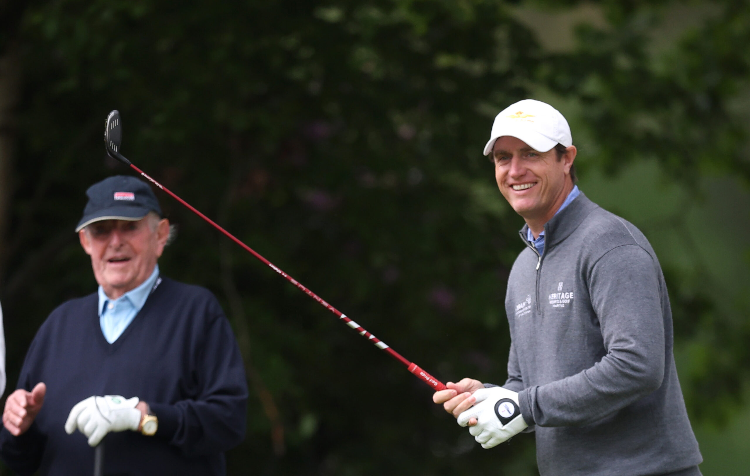Nicolas Colsaerts of Belgium plays in the pro-am watched by Vic Swerts, CEO of Soudal, ahead of the 2026 Soudal Open.