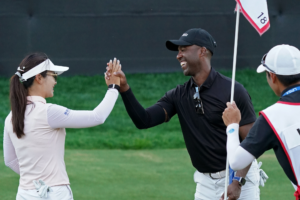 TPI Athlete Ricky Lewis high-fives his LPGA Tour teammate Weiwei Zhang after the 2026 Fortinet Founders Cup Pro-am.