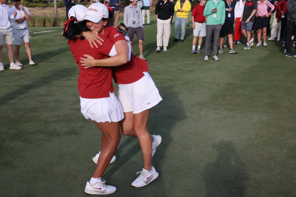 Megha Ganne and Andrea Revuelta hug in celebration after winning the National Championship.