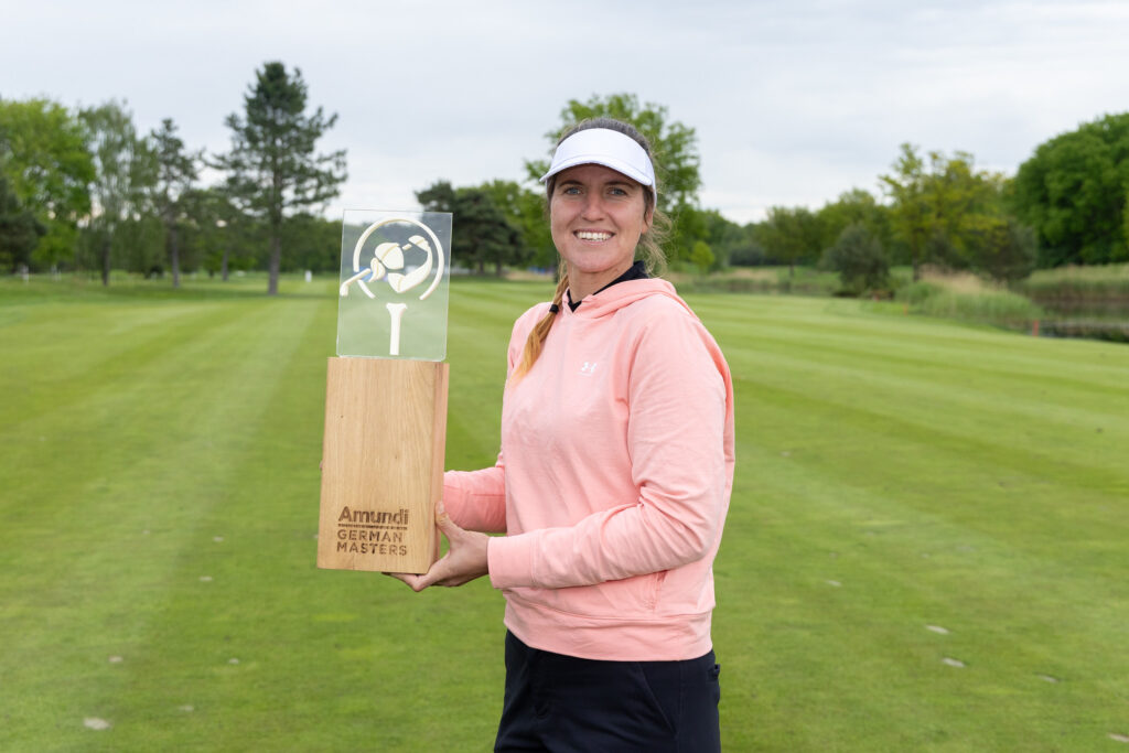 Germany's Leonie Harm hoists her first professional trophy at the 2026 Amundi German Masters. 