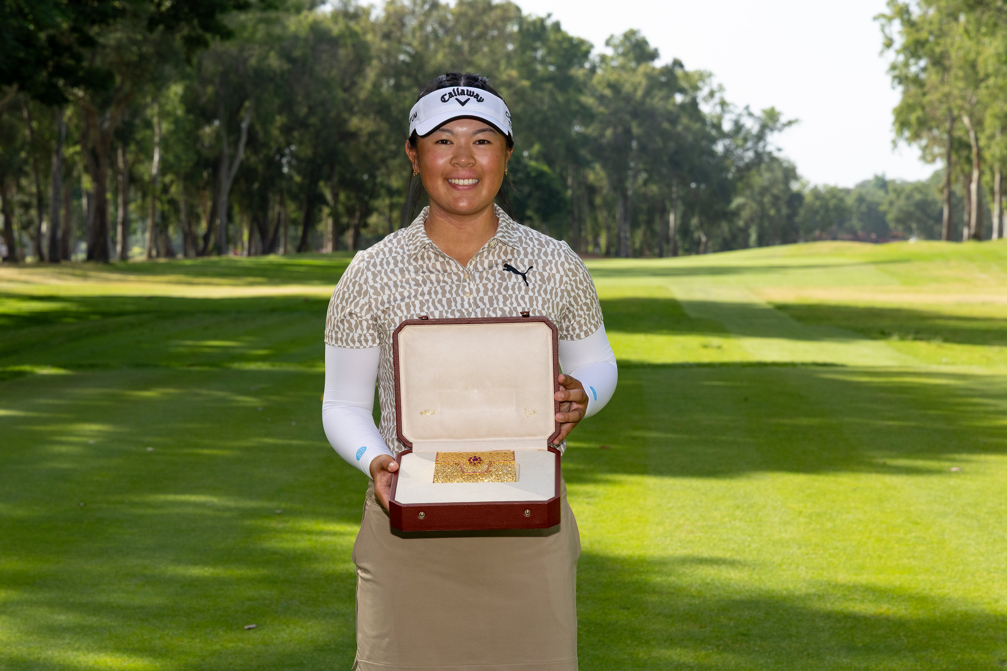 Anna Huang's trophy for the Lalla Meryem Cup is a gold-plated purse.