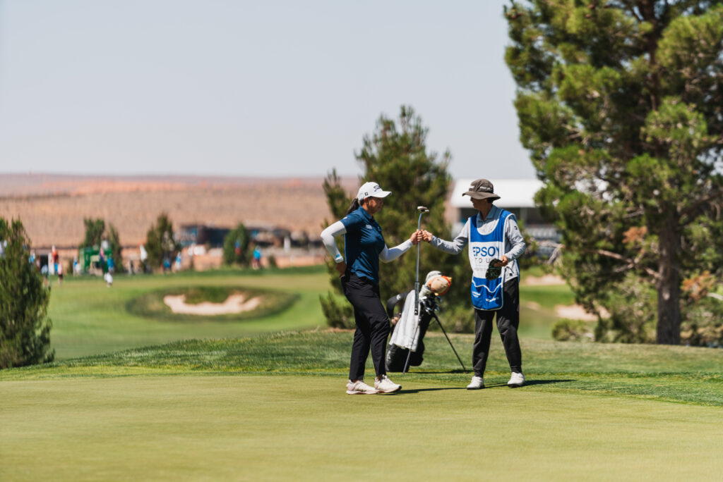Fiona Xu fist bumping her caddie during the second round of the 2026 Copper Rock Championship.