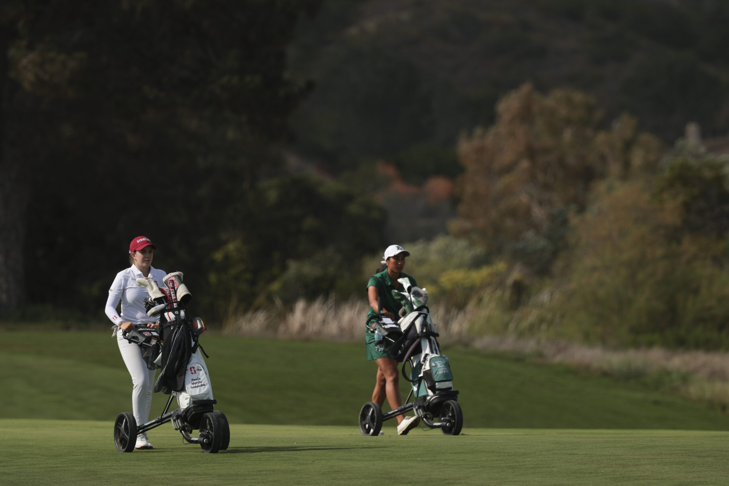 Paula Martín Sampedro of Stanford walks the course alongside Janae Leovao of Eastern Michigan during the Semifinals at the NCAA Division I Women’s Golf Championship.