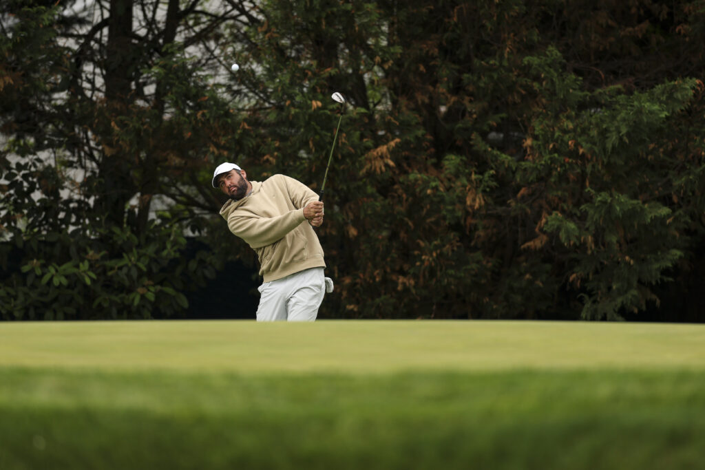 Scottie Scheffler hits his shot on the 12th hole during the 2026 PGA Championship Practice Round.