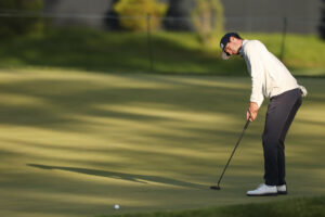 Alex Smalley putts on the 15th hole during the first round of the 2026 PGA Championship at Aronimink Golf Club.