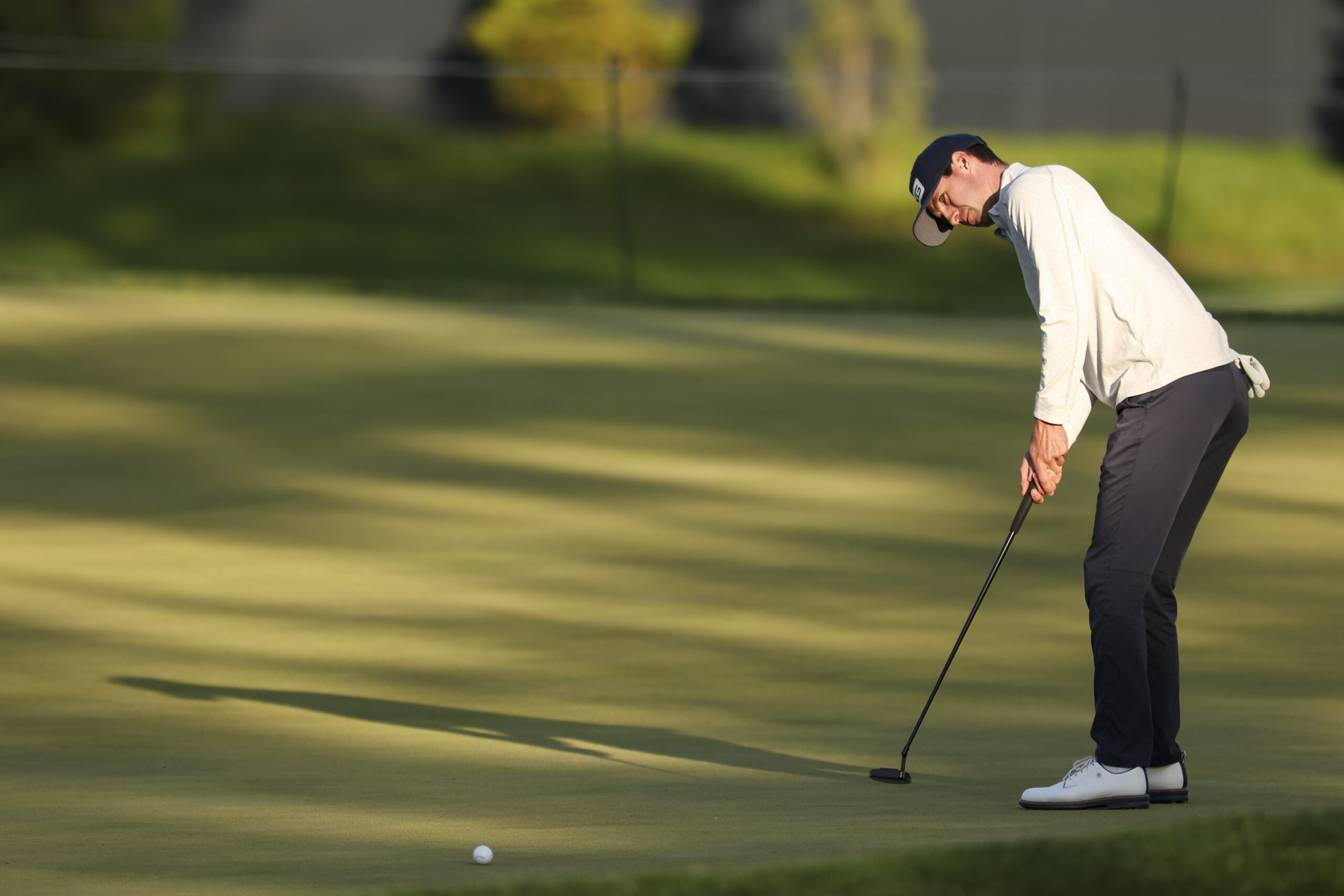 Alex Smalley putts on the 15th hole during the first round of the 2026 PGA Championship at Aronimink Golf Club.