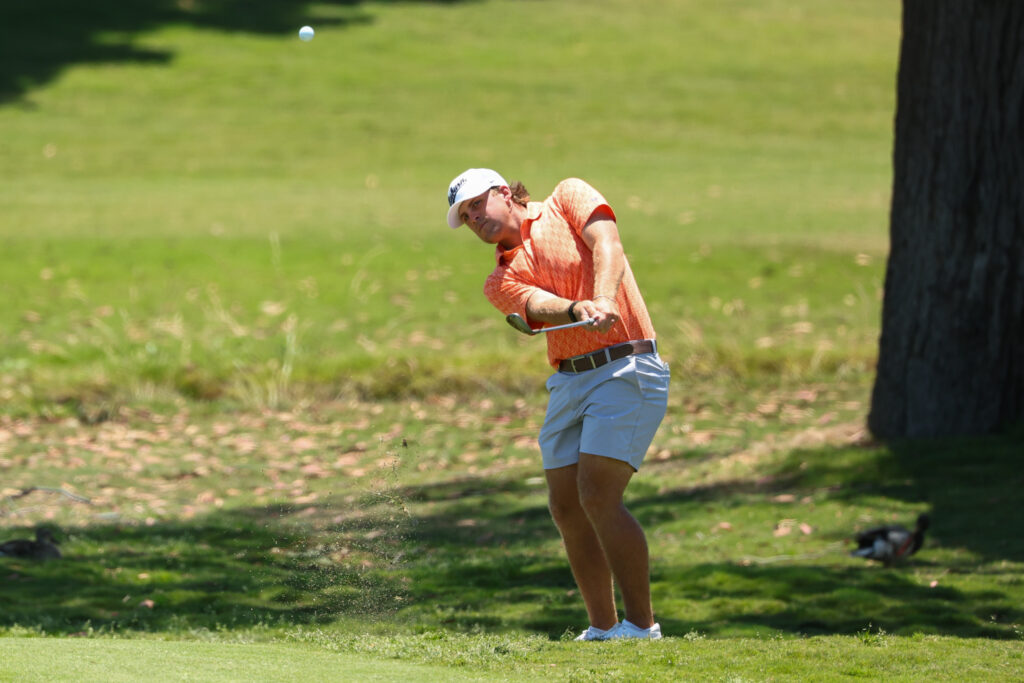 Josiah Gilbert of the Auburn Tigers chips during the 2026 Division I Men’s Golf Championship.