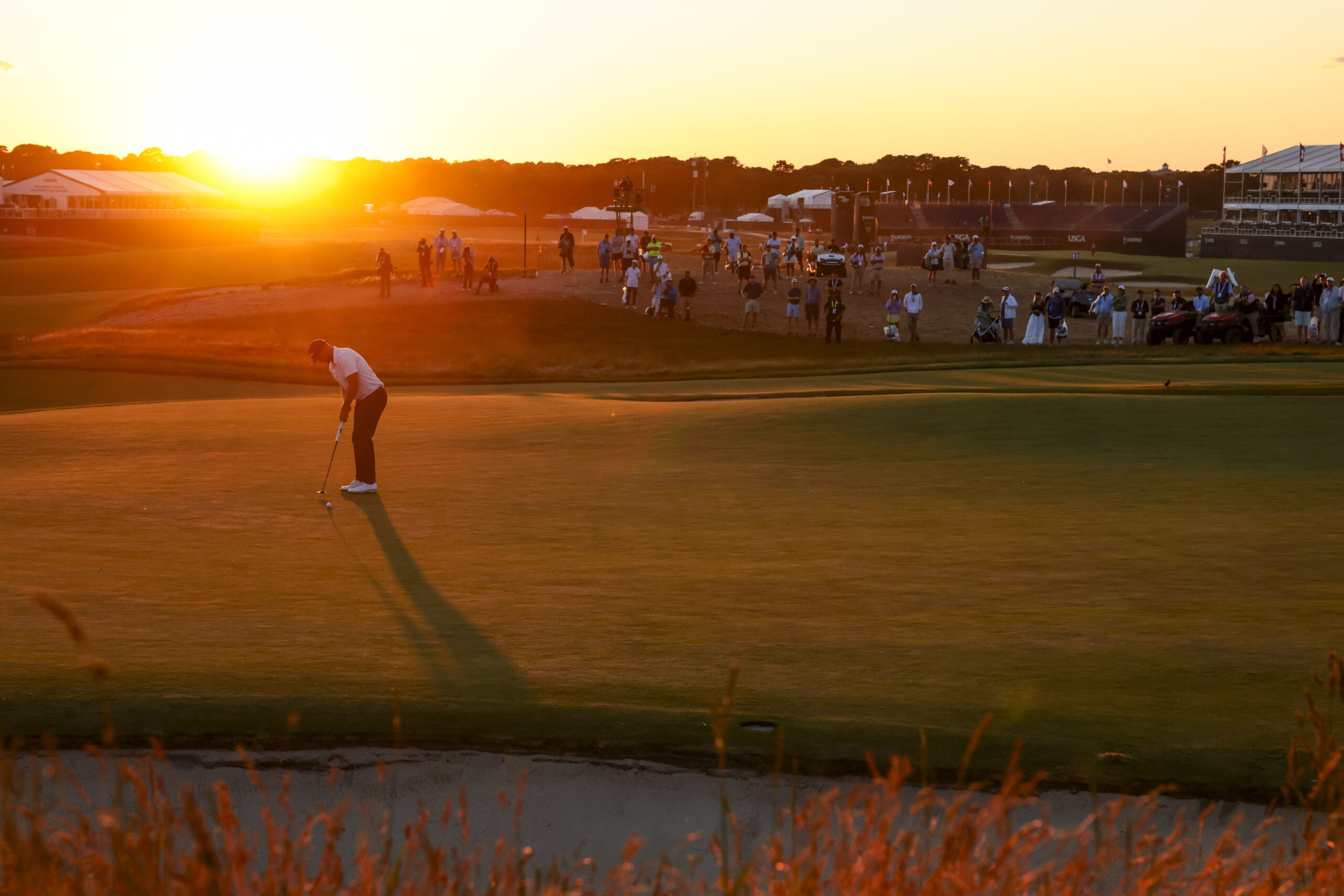 Wyndham Clark watches his putt on the 18th hole during the third round of the 2026 U.S. Open.
