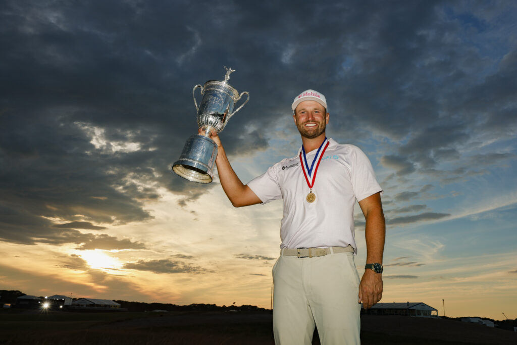 2026 U.S. Open Champion, Wyndham Clark, hoists his trophy after the final round. 