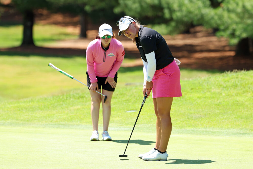 Jennifer Kupcho (R) and Leona Maguire (L) line up a putt on the fifth hole during the second round of the 2025 Dow Championship.