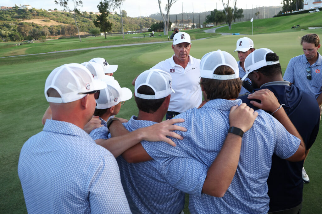 Auburn's Head Coach Nick Clinard talks to his team after a semifinal win against the Oklahoma State Cowboys during the 2026 NCAA Division I Men’s Golf Championship.