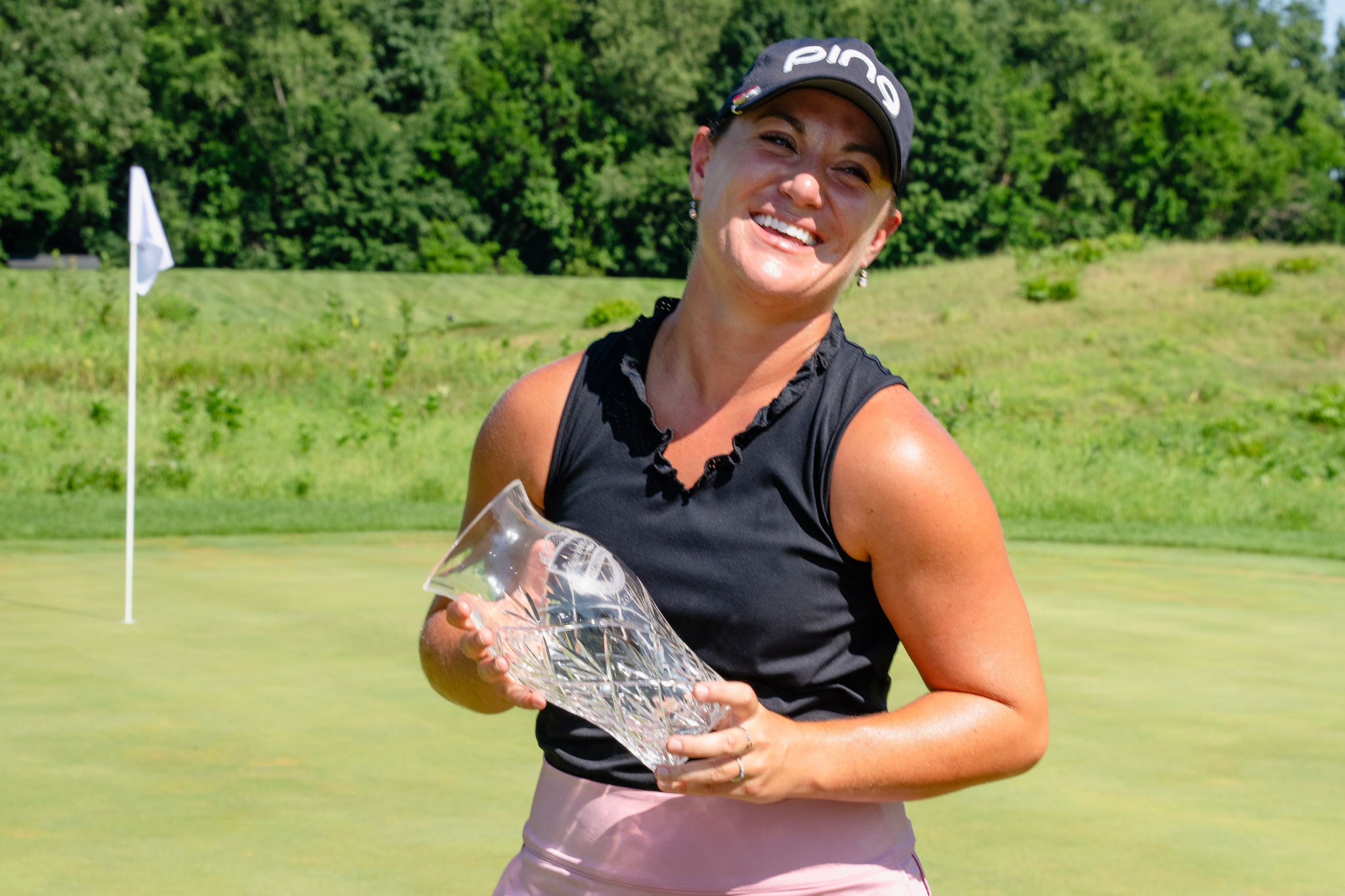 Haylee Harford Sanchez celebrates her win with a trophy after the final round of the 2026 Four Winds Invitational.