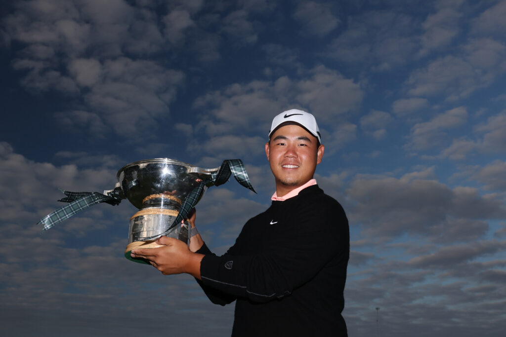Tom Kim of South Korea poses with the trophy following his victory at the 2026 Genesis Scottish Open.