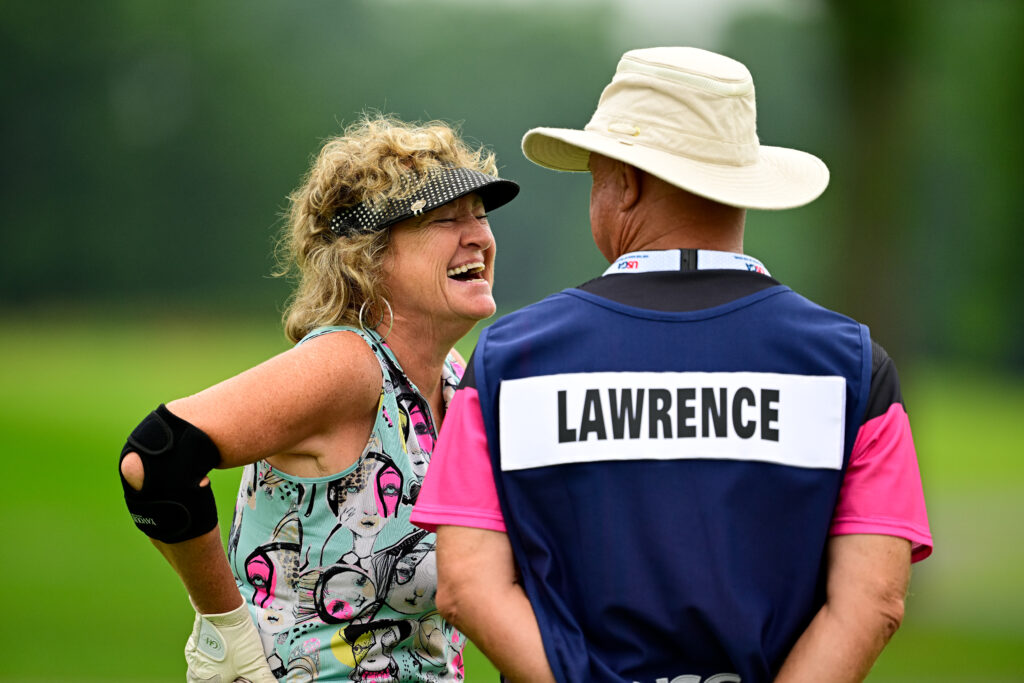 Cindy Lawrence celebrates with her caddie on the ninth hole during the second round of the 2026 U.S. Adaptive Open.