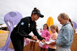 Defending champion Miyu Yamashita signs autographs ahead of the 2026 AIG Women's Open.