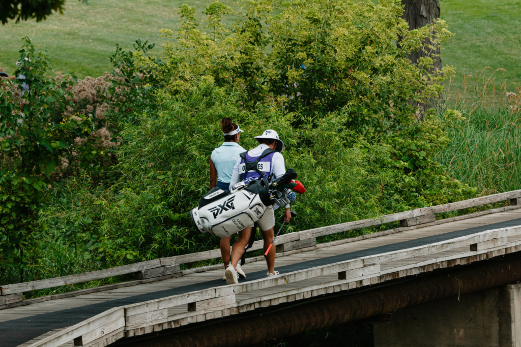 Current Race for the Card leader Lauren Olivares crosses a bridge during the Greater Toledo Open.