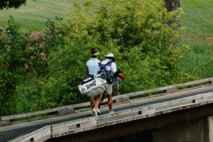 Current Race for the Card leader Lauren Olivares crosses a bridge during the Greater Toledo Open.