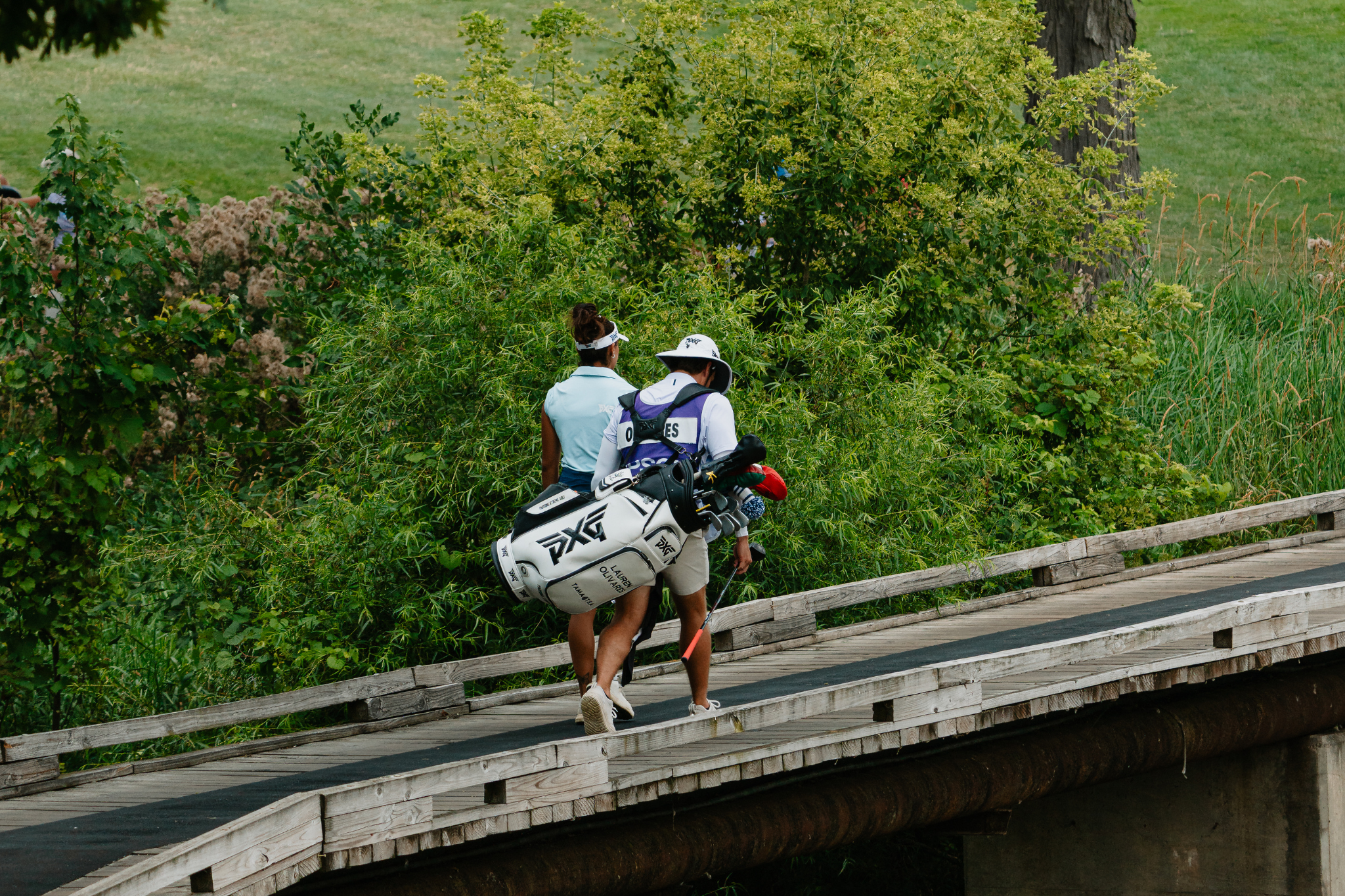 Current Race for the Card leader Lauren Olivares crosses a bridge during the Greater Toledo Open.