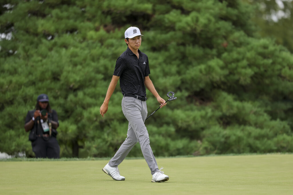 Jay Leng Jr. walks while watching his putt at the 12th hole green during the finals of the 2026 U.S. Amateur.
