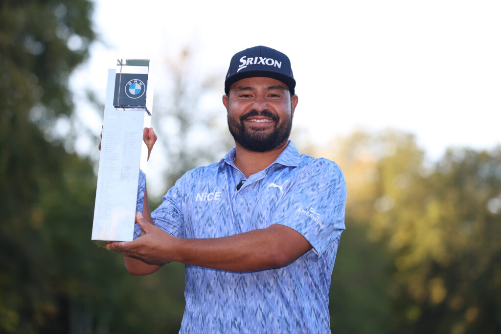 J.J. Spaun of the United States poses with the trophy following victory on day four of the 2026 BMW PGA Championship.