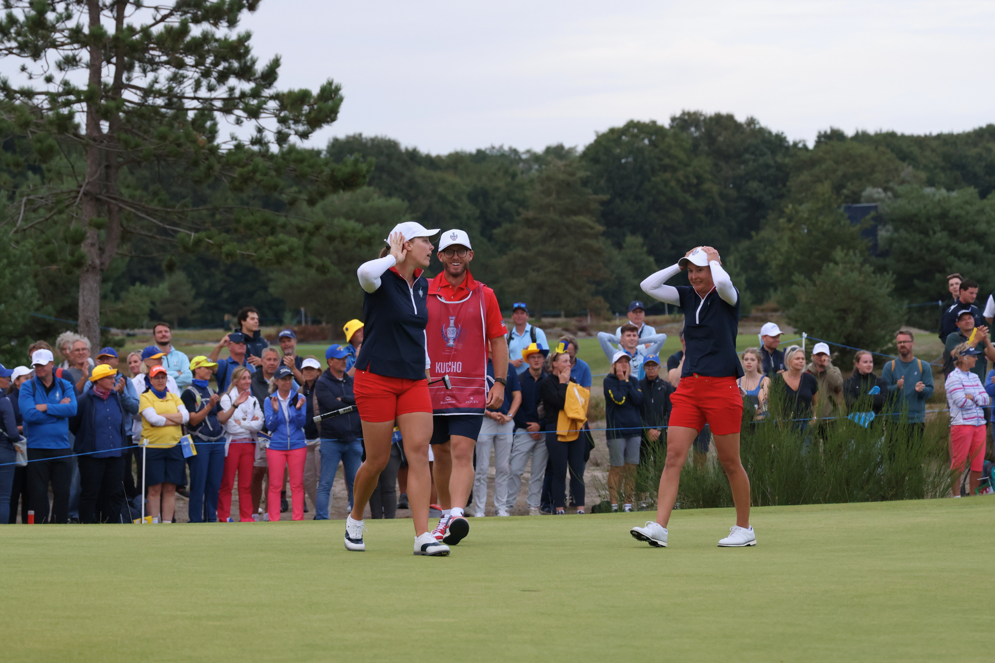 Jennifer Kupcho hypes up her team on the 18th hole after sinking the winning putt while playing partner Lindy Duncan holds her head in disbelief.