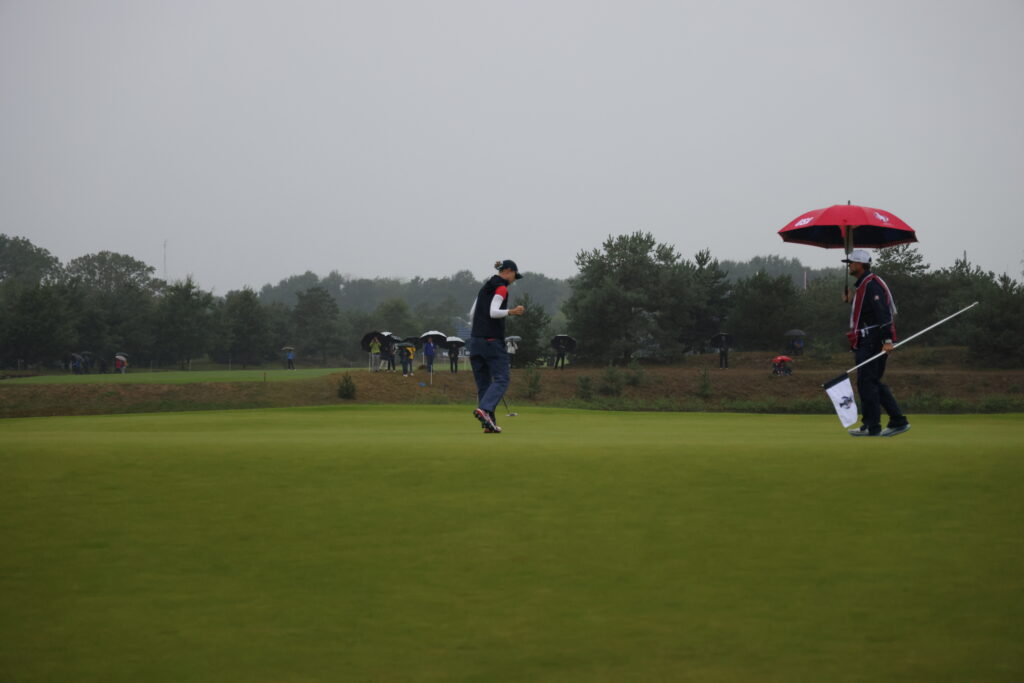 Nelly Korda fist pumps as she makes her birdie putt on Hole 6 to go 1 UP.