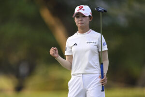 Youmin Hwang of South Korea celebrates after a putt on the 18th green during the second round of the 2025 LOTTE Championship presented by Hoakalei.
