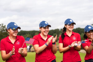Team USA cheers on their teammates as they earn their final points for the PING Junior Solheim Cup.