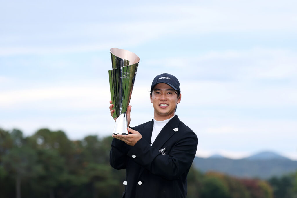 Yuto Katsuragawa stands with the 2026 Genesis Championship trophy.