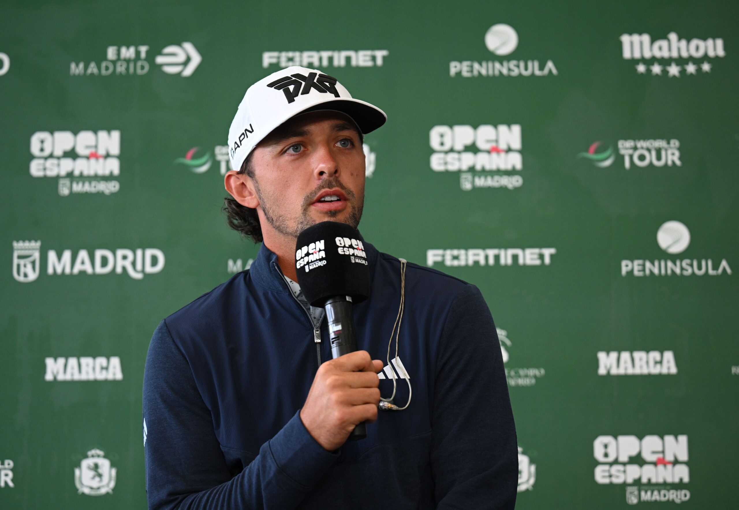 Marco Penge speaks to the media about defending his title in Spain.